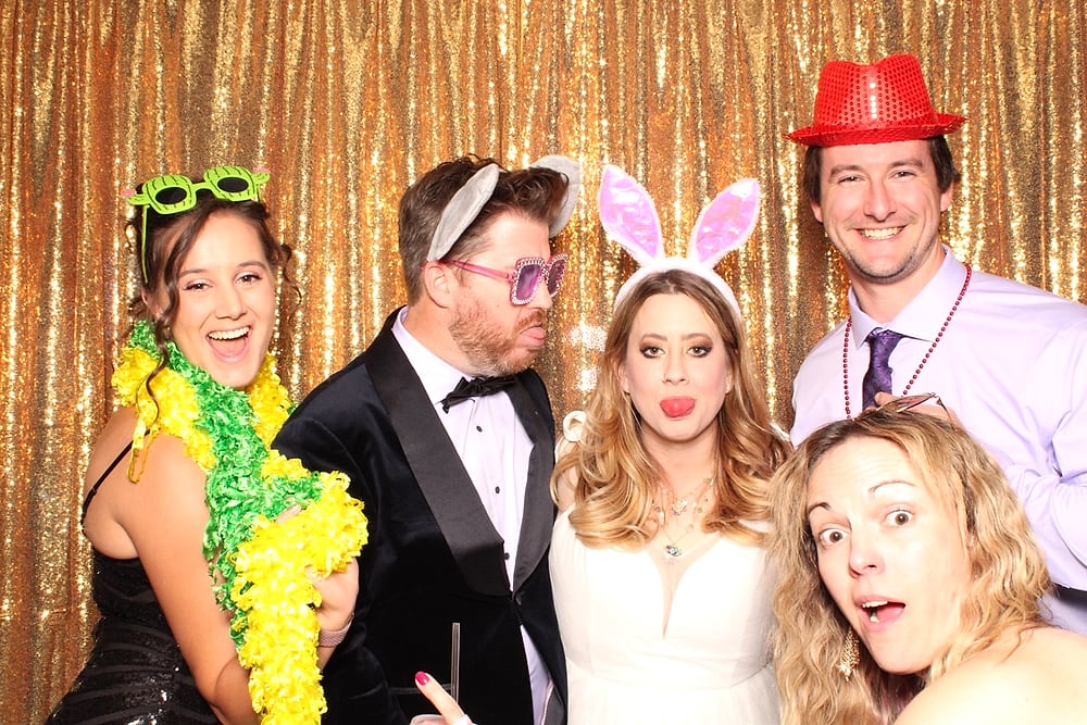 Group celebrating at the Posed photo booth, Austin wedding